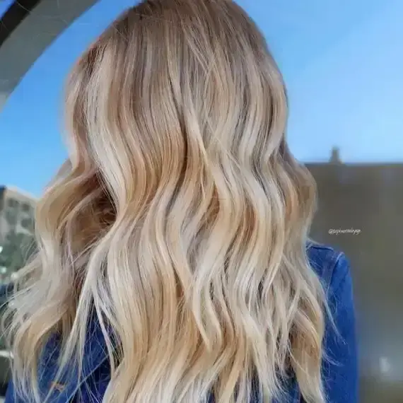 balayage lived in blonde long hair bright blonde honey tones.